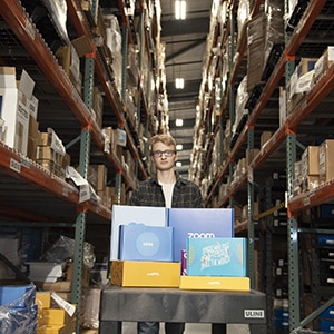 Man grabbing orders for commercial fulfillment services.