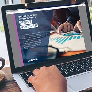 A laptop screen displaying Printing for Less's reseller services.
