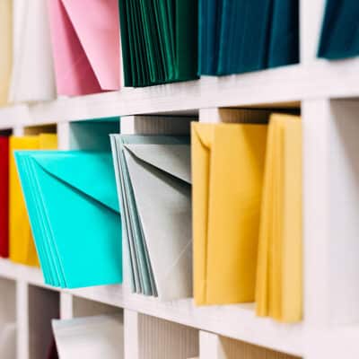 Multiple,Piles,Of,Various,Postal,Envelopes,Arranged,On,A,Shelf