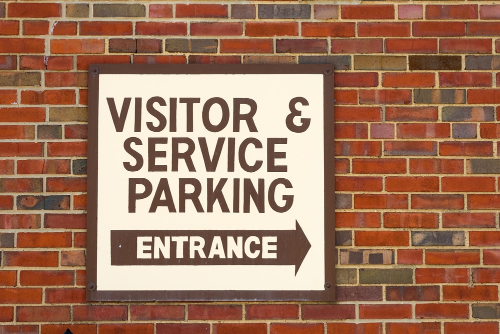 visitor and service parking entrance sign