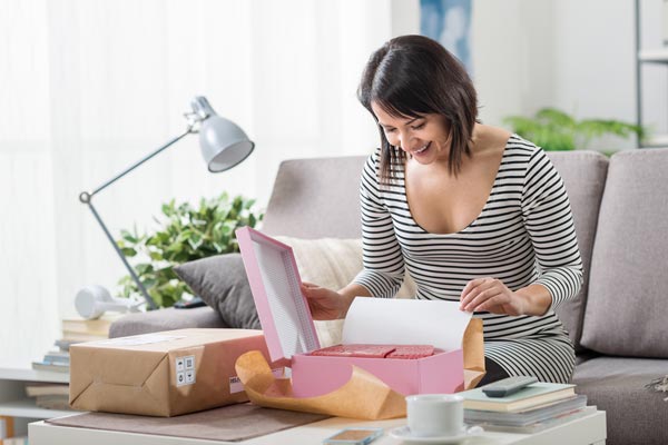 woman opening package